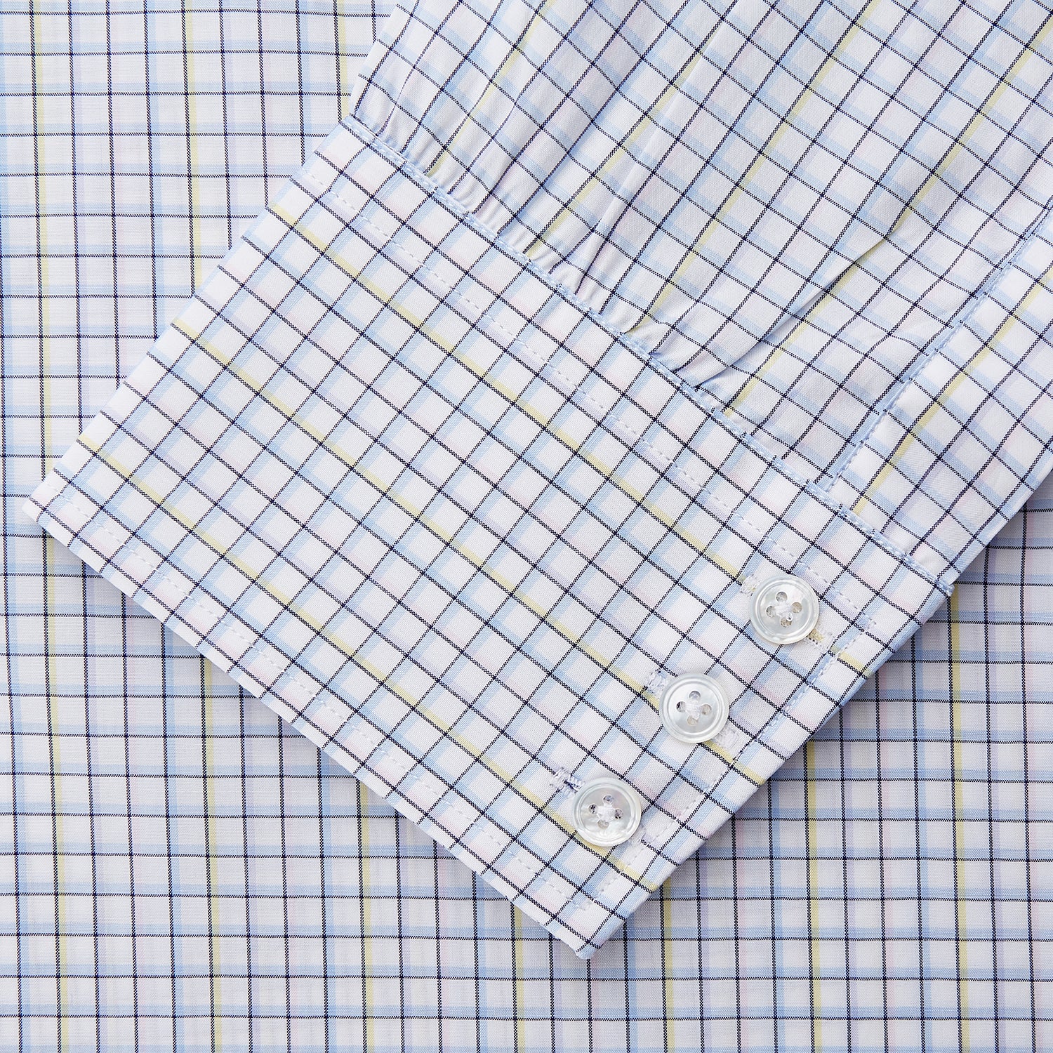 View 3 of product The Turnbull & Asser Purple Multi-check Cotton Mayfair Shirt is a men’s long-sleeve, button-up dress shirt with a T&A collar, featuring a purple multi-check pattern and shown flat on a white background.