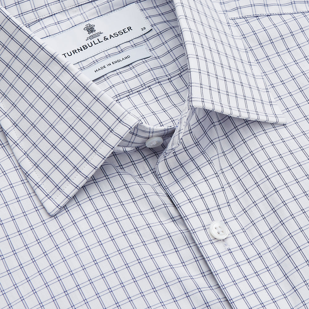 The Turnbull & Asser White and Blue Check Cotton Regular Fit Mayfair Shirt features a classic button-up design with long sleeves, traditional collar and cuffs, displayed flat against a white background.