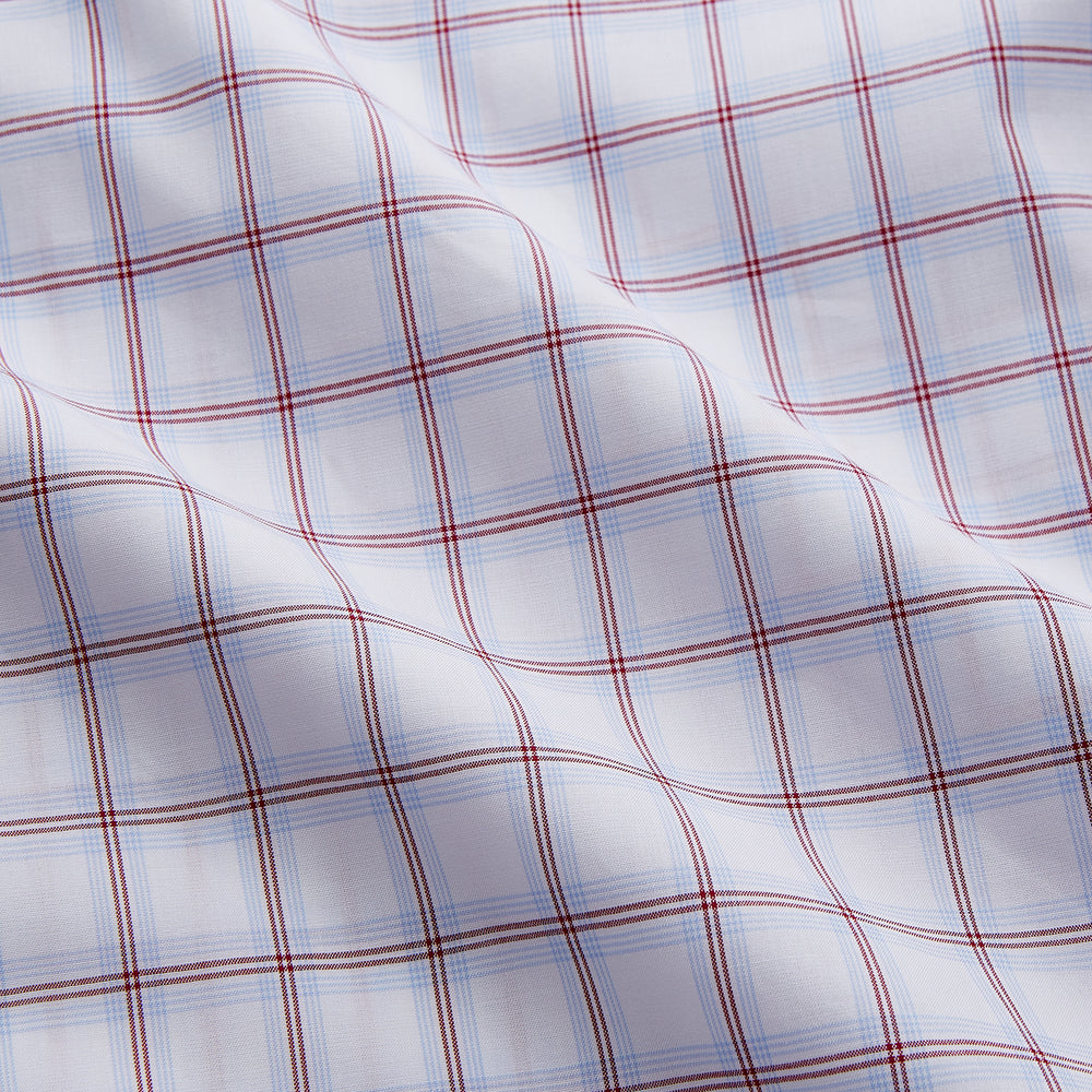 The Turnbull & Asser Red and Blue Multi-check Cotton Regular Fit Mayfair Shirt features a white base with red and blue checks, long sleeves, a T&A collar, and is shown flat against a white surface.