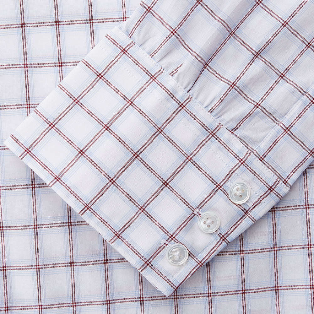The Turnbull & Asser Red and Blue Multi-check Cotton Regular Fit Mayfair Shirt features a white base with red and blue checks, long sleeves, a T&A collar, and is shown flat against a white surface.