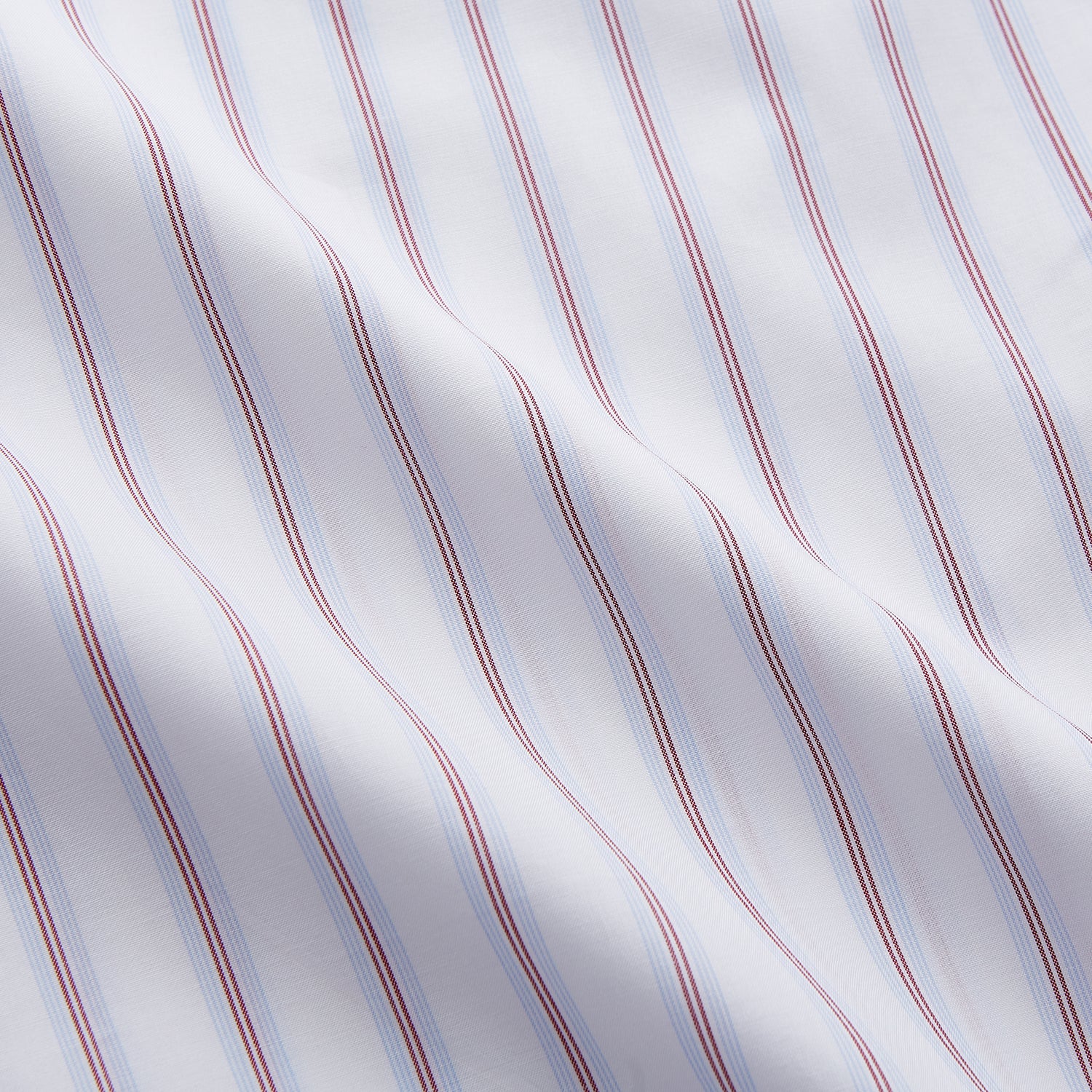 View 6 of product The Turnbull & Asser Red and Blue Multi-stripe Cotton Regular Fit Mayfair Shirt features a button-down front and classic collar, displayed on a plain white background.