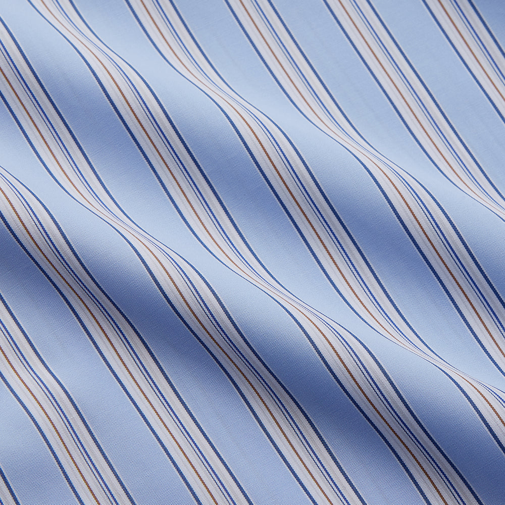 The Turnbull & Asser Pale Blue Multi-stripe Cotton Regular Fit Mayfair Shirt, featuring long sleeves, buttoned cuffs, and a signature T&A collar, is laid flat on a white background.