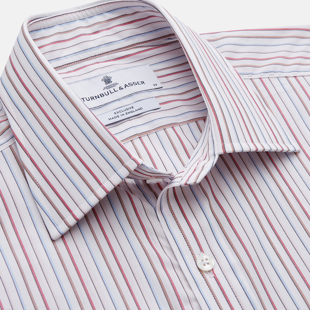 The Turnbull & Asser Red Multi-stripe Cotton Regular Fit Mayfair Shirt features red and blue vertical stripes on white, a T&A collar, and long sleeves. The shirt is shown neatly laid flat on a white surface.