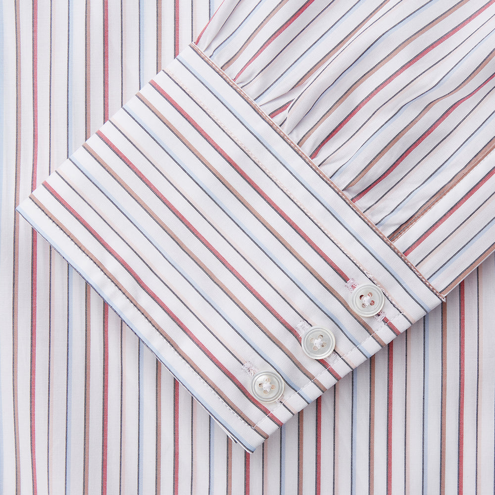 The Turnbull & Asser Red Multi-stripe Cotton Regular Fit Mayfair Shirt features red and blue vertical stripes on white, a T&A collar, and long sleeves. The shirt is shown neatly laid flat on a white surface.