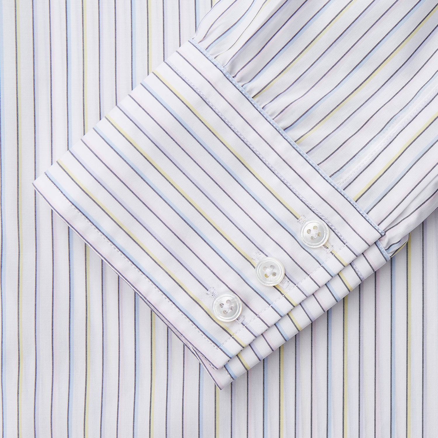 View 3 of product The Turnbull & Asser Purple Multi-stripe Cotton Regular Fit Mayfair Shirt is a men’s button-up with a T&A collar, showcasing thin vertical stripes, neatly laid flat against a white background.