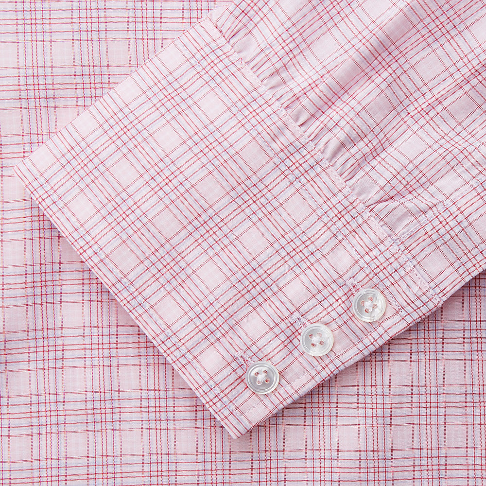 The Turnbull & Asser Pink Multi-check Cotton Regular Fit Mayfair Shirt features long sleeves, a T&A collar, buttoned cuffs, and a light pink check pattern, shown against a plain white background.