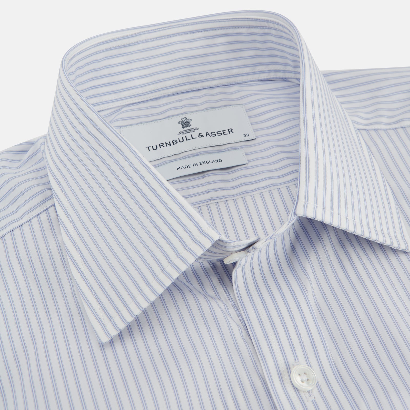 View 2 of product The Turnbull & Asser Pale Blue and White Multi-stripe Cotton Regular Fit Mayfair Shirt features a T&A collar and buttoned cuffs, shown on a plain white background.