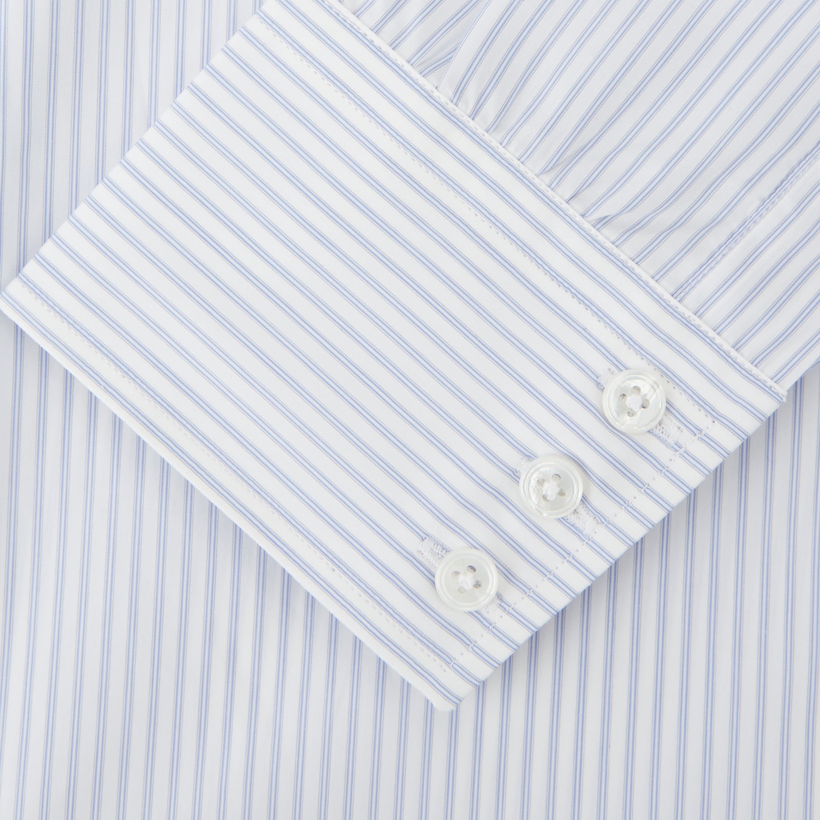 View 3 of product The Turnbull & Asser Pale Blue and White Multi-stripe Cotton Regular Fit Mayfair Shirt features a T&A collar and buttoned cuffs, shown on a plain white background.