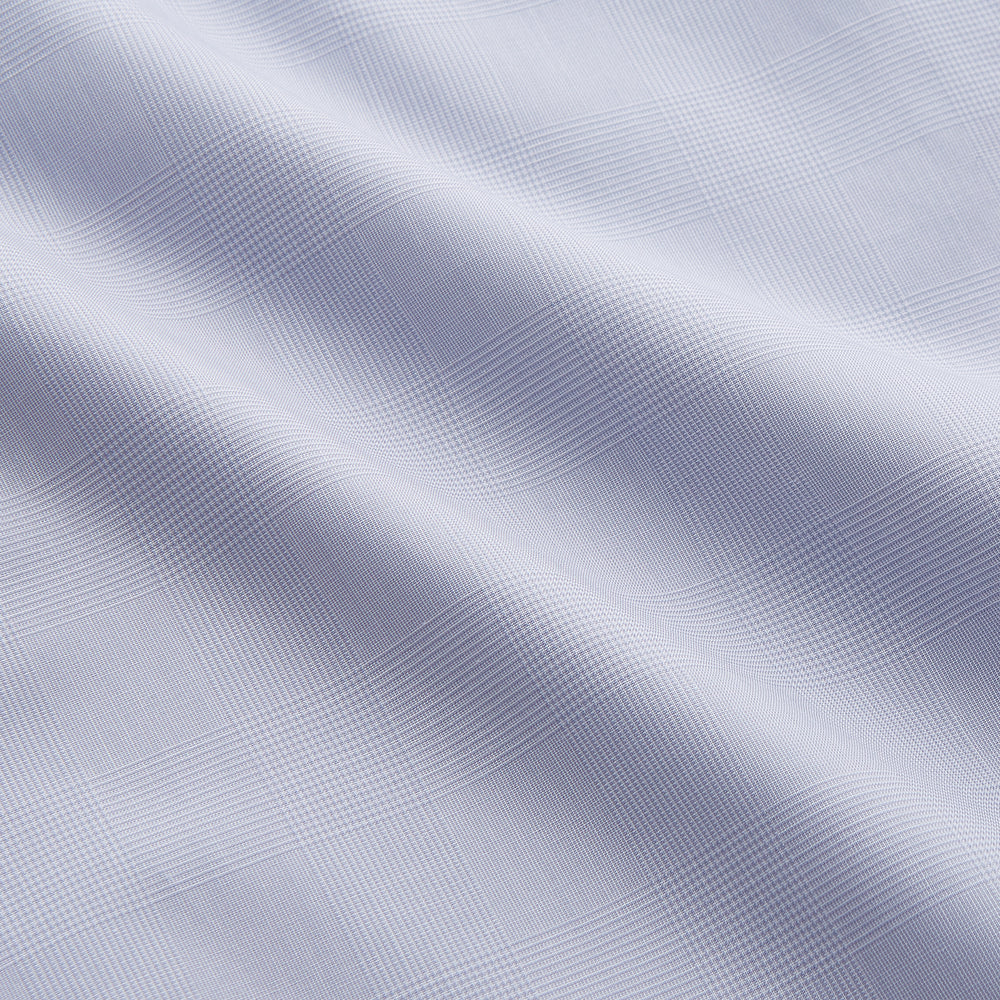 The Turnbull & Asser Faded Blue Block Check Cotton Shelton Shirt features a tailored fit, long sleeves, button-down front, and classic collar, displayed flat on a white background.