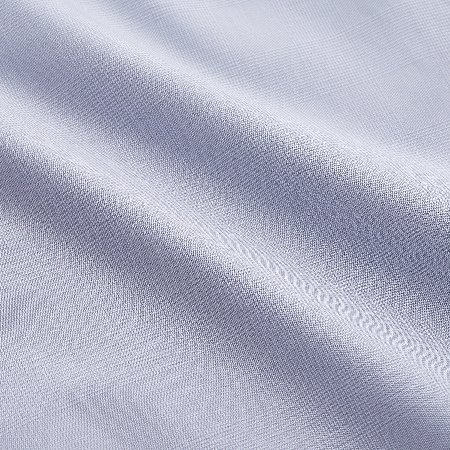View 4 of product The Turnbull & Asser Faded Blue Block Check Cotton Shelton Shirt features a tailored fit, long sleeves, button-down front, and classic collar, displayed flat on a white background.