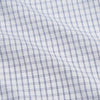 View 4 of product The Turnbull & Asser White and Blue Check Cotton Tailored Fit Shelton Shirt, a men's button-up dress shirt, is shown laid flat on a white background.