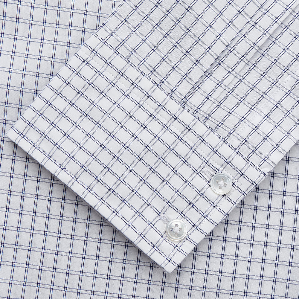 The Turnbull & Asser White and Blue Check Cotton Tailored Fit Shelton Shirt, a men's button-up dress shirt, is shown laid flat on a white background.