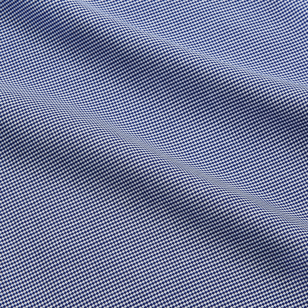 The Turnbull & Asser Navy Pattern Cotton Voile Tailored Fit Shelton Shirt is laid flat, showcasing its classic collar and white front and cuff buttons.