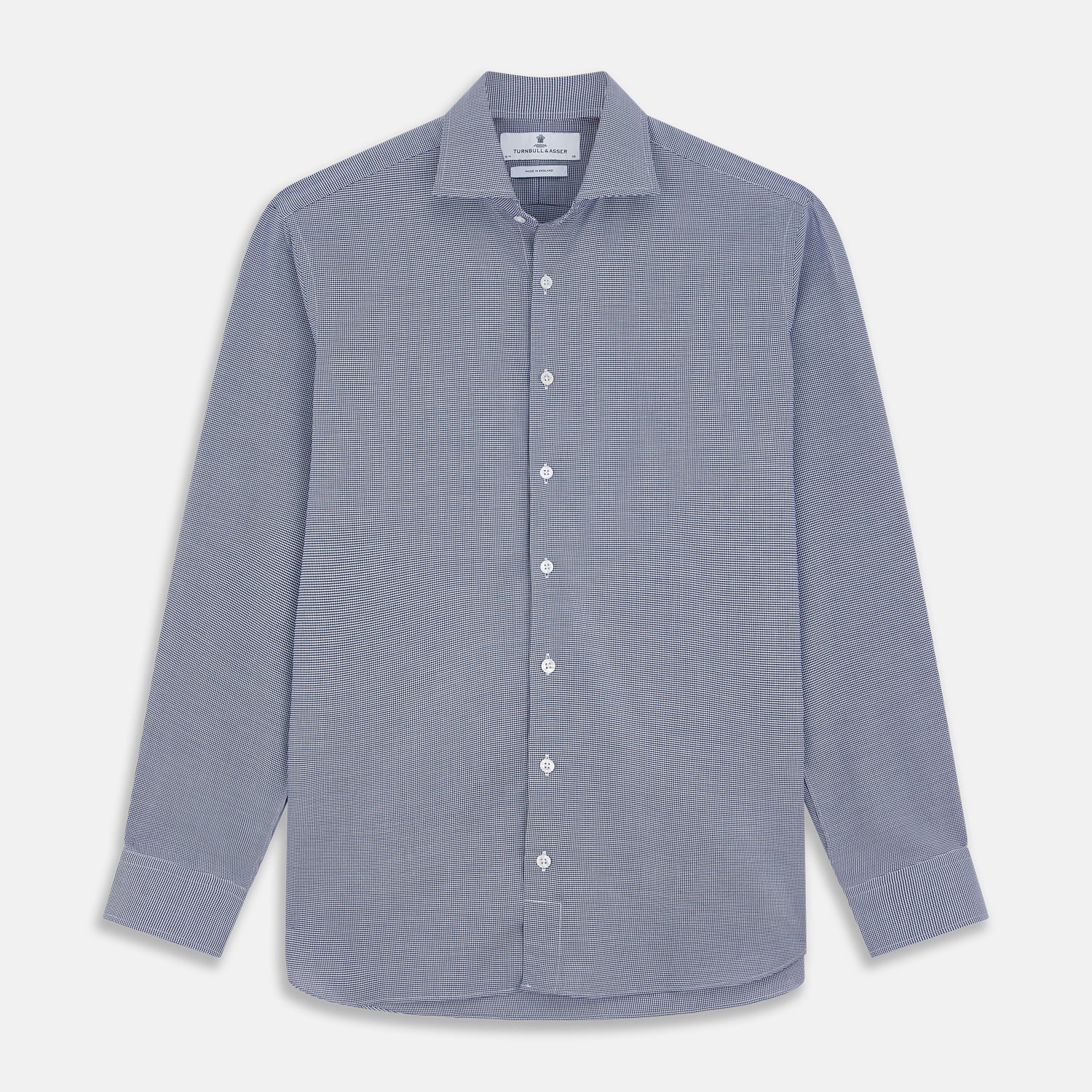 View 1 of product The Turnbull & Asser Navy Pattern Cotton Voile Tailored Fit Shelton Shirt is laid flat, showcasing its classic collar and white front and cuff buttons.