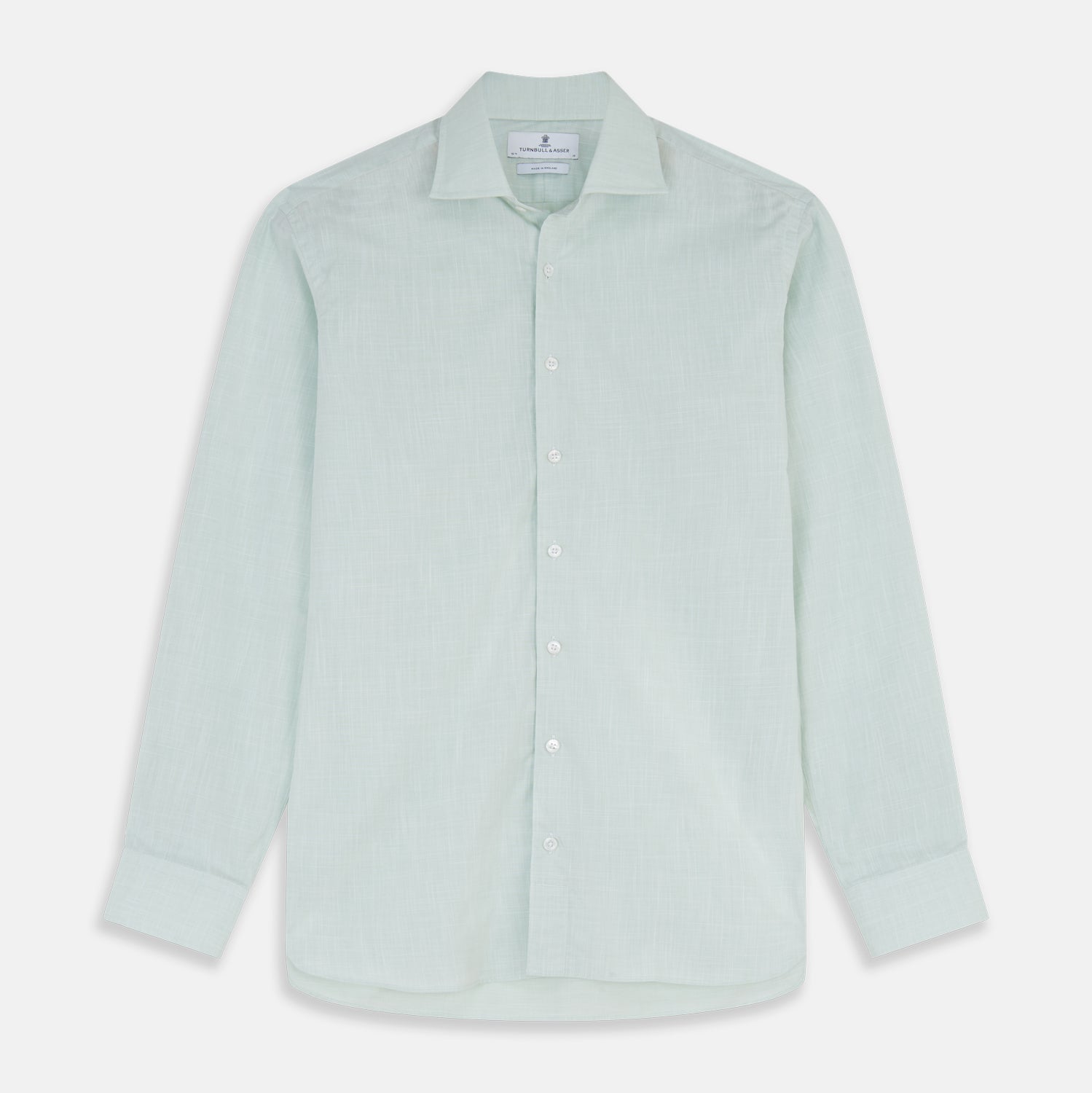 View 1 of product The Turnbull & Asser Light Green Chambray Tailored Fit Shelton Shirt features long sleeves, a classic collar, and white buttons—an elegant men's formal shirt shown neatly laid flat on a white background.