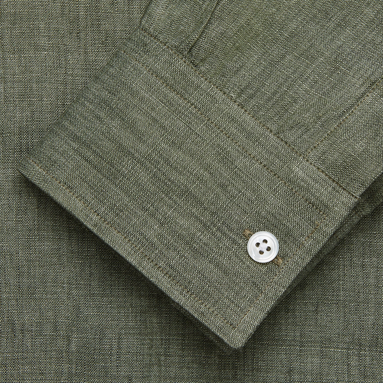 View 2 of product The Sage Green Linen Weekend Fit Finch Shirt by Turnbull & Asser features a classic collar, white buttons, and a single chest pocket—an essential piece for any men's wardrobe. Displayed flat on a white background for a clean look.