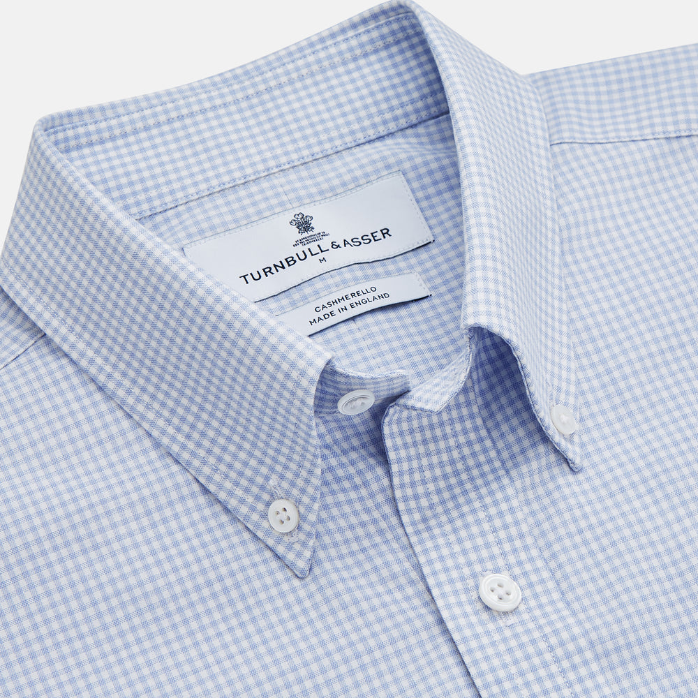The Turnbull & Asser Pale Blue Multi Check Cashmerello Weekend Fit Hayne Shirt features a Dorset button-down collar, long sleeves, and front buttons. Shown laid flat on a white background.
