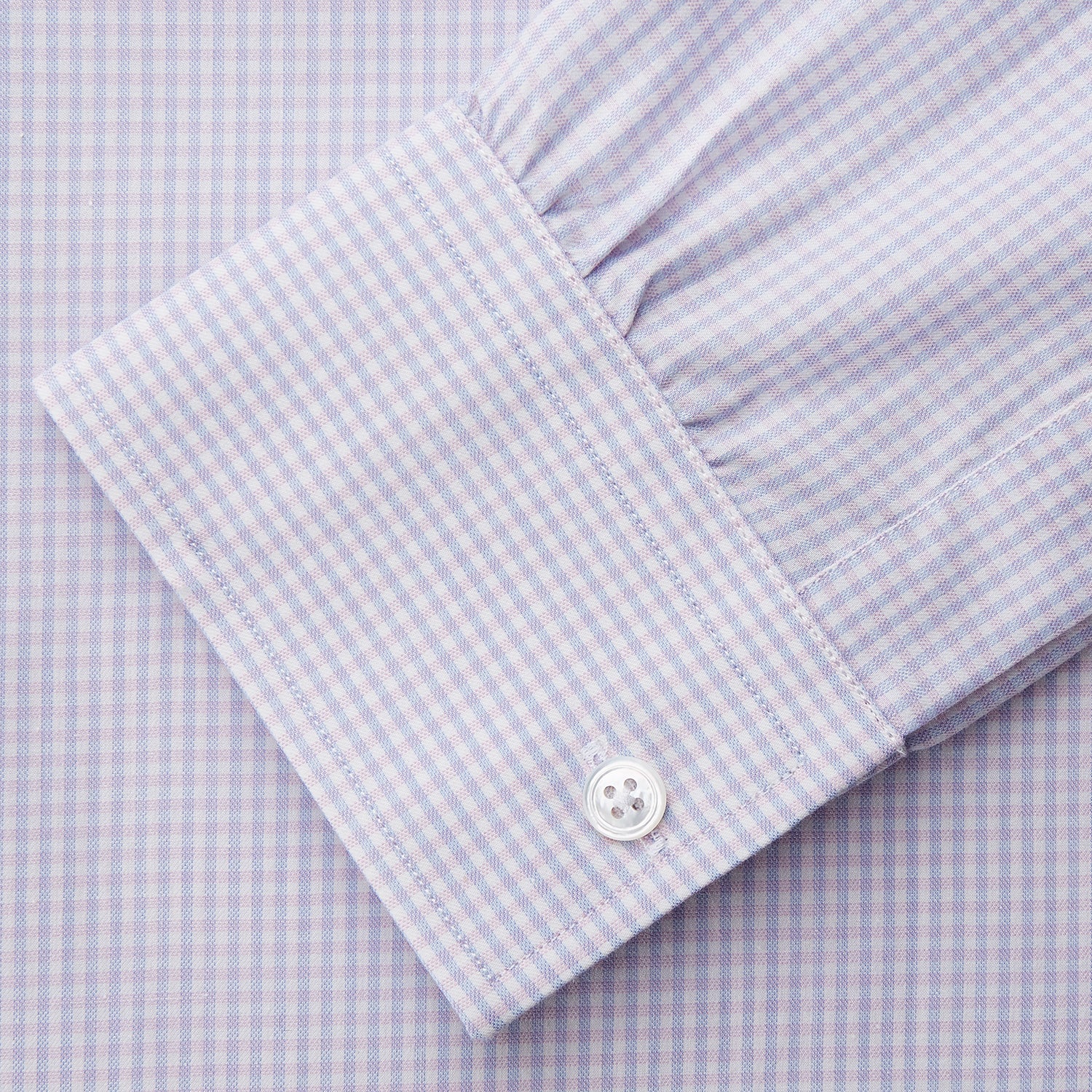 View 3 of product The Blue Multi Check Cashmerello Weekend Fit Hayne Shirt by Turnbull & Asser features long sleeves, a button-down front, Dorset collar, buttoned cuffs, and a blue check pattern, shown laid flat on a white background.