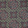 View 3 of product The Green Floral Tile Silk Tie by Turnbull & Asser features a gold background with a repeating green floral pattern in red, navy blue, and cream, showcasing classic style and an evenly distributed silk texture throughout.