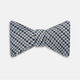 The Turnbull & Asser Blue Multi Puppytooth Silk Bow Tie features a classic puppytooth pattern in shades of blue, displayed against a plain white background.