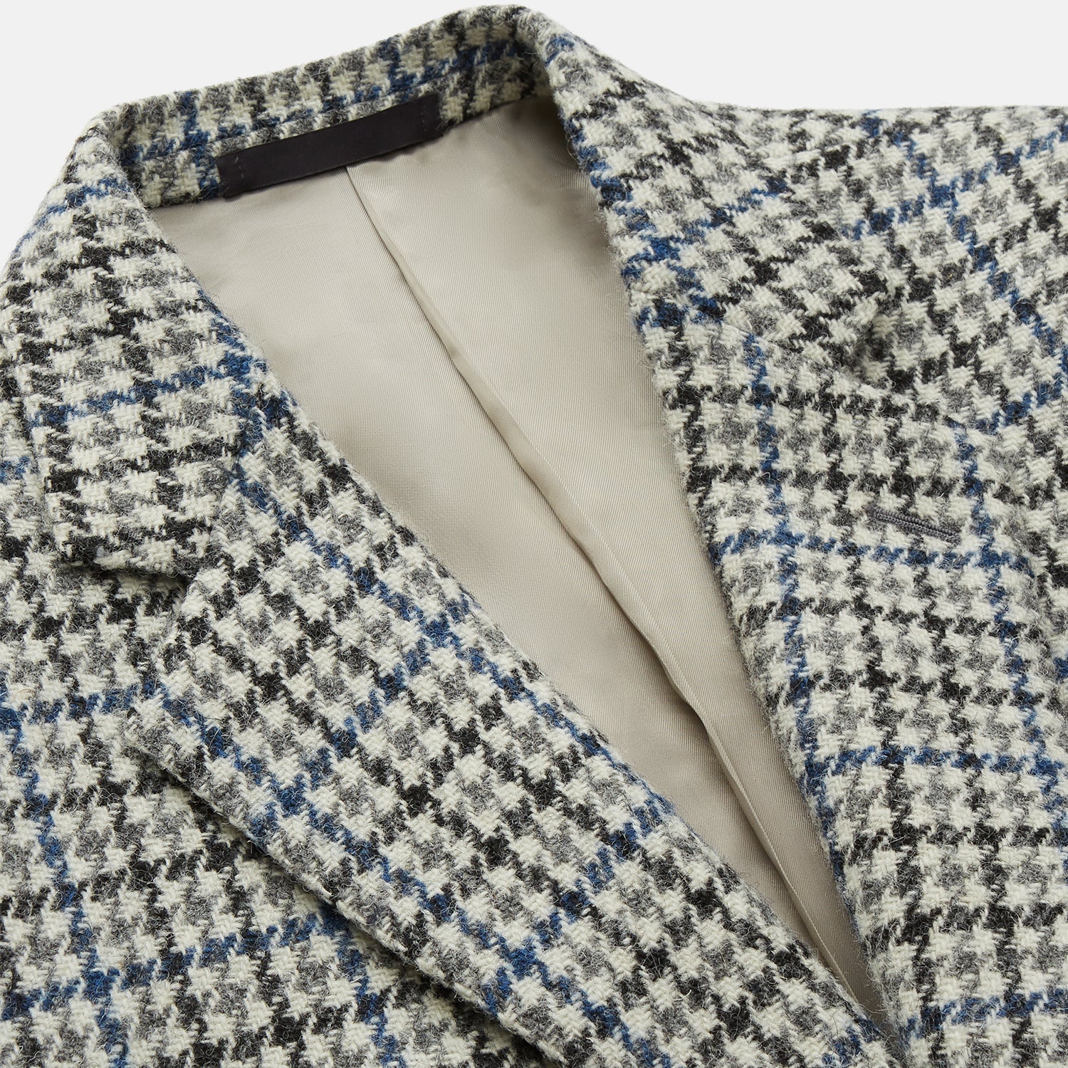 View 2 of product The Grey and Navy Tweed Barrington Blazer by Turnbull & Asser is a single-breasted jacket with notched lapels, two front buttons, flap pockets, and a tailored fit—expertly made in Italy for sophisticated style.