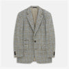 View 1 of product The Grey and Navy Tweed Barrington Blazer by Turnbull & Asser is a single-breasted jacket with notched lapels, two front buttons, flap pockets, and a tailored fit—expertly made in Italy for sophisticated style.