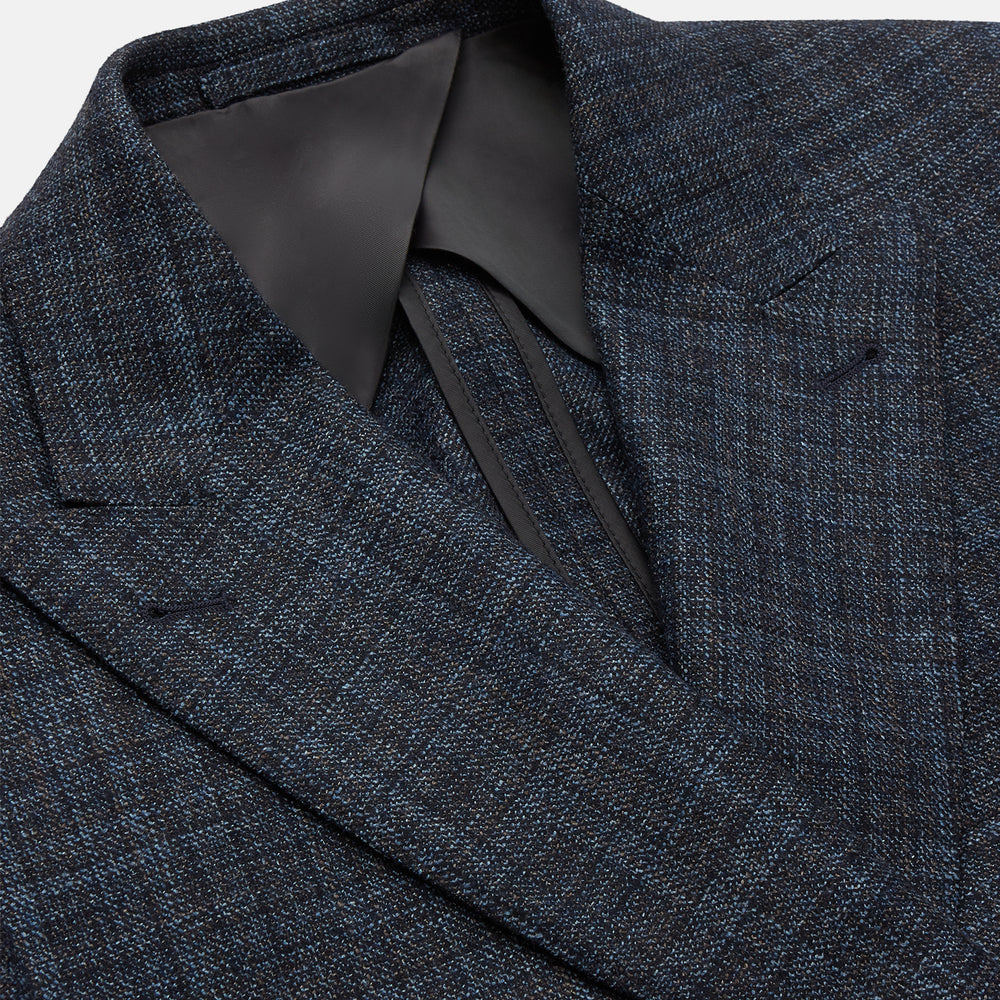The Turnbull & Asser Navy Check Wool and Cashmere Blend Double Breasted Bertie Blazer features peak lapels, front flap pockets, and brown buttons, shown against a plain white background.