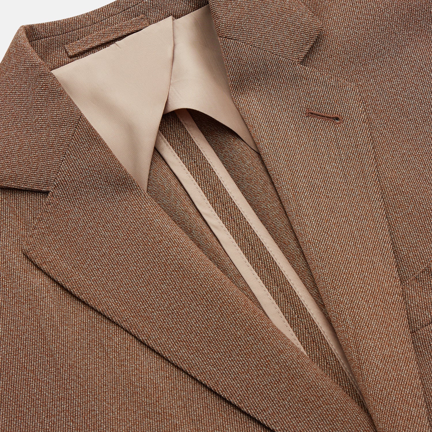 View 3 of product The Brown Virgin Wool Bern Blazer by Turnbull & Asser features notch lapels, two front patch pockets, a chest pocket, buttoned cuffs, and two buttons, shown over a beige collared shirt against a white background.