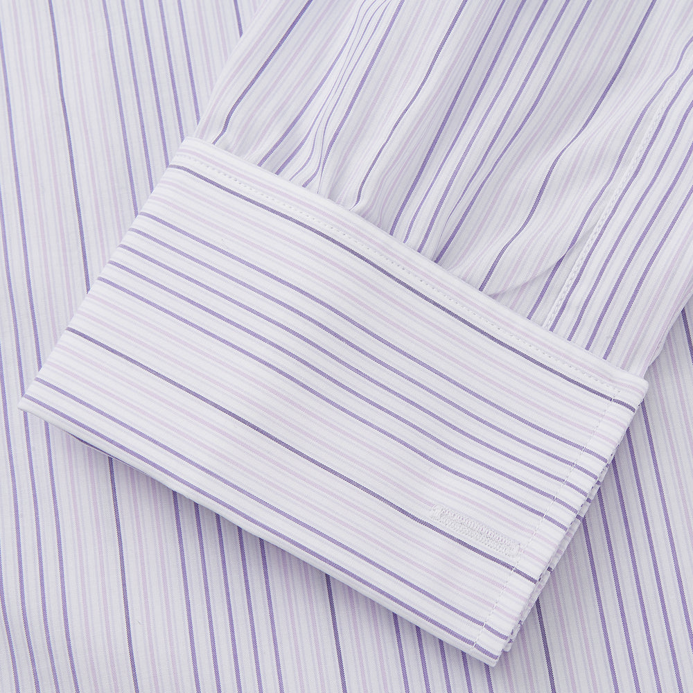 The Turnbull & Asser Purple and White Stripe Twill Cotton Regular Fit Shirt features a T&A collar, double cuffs, and thin vertical stripes, displayed against a white background.