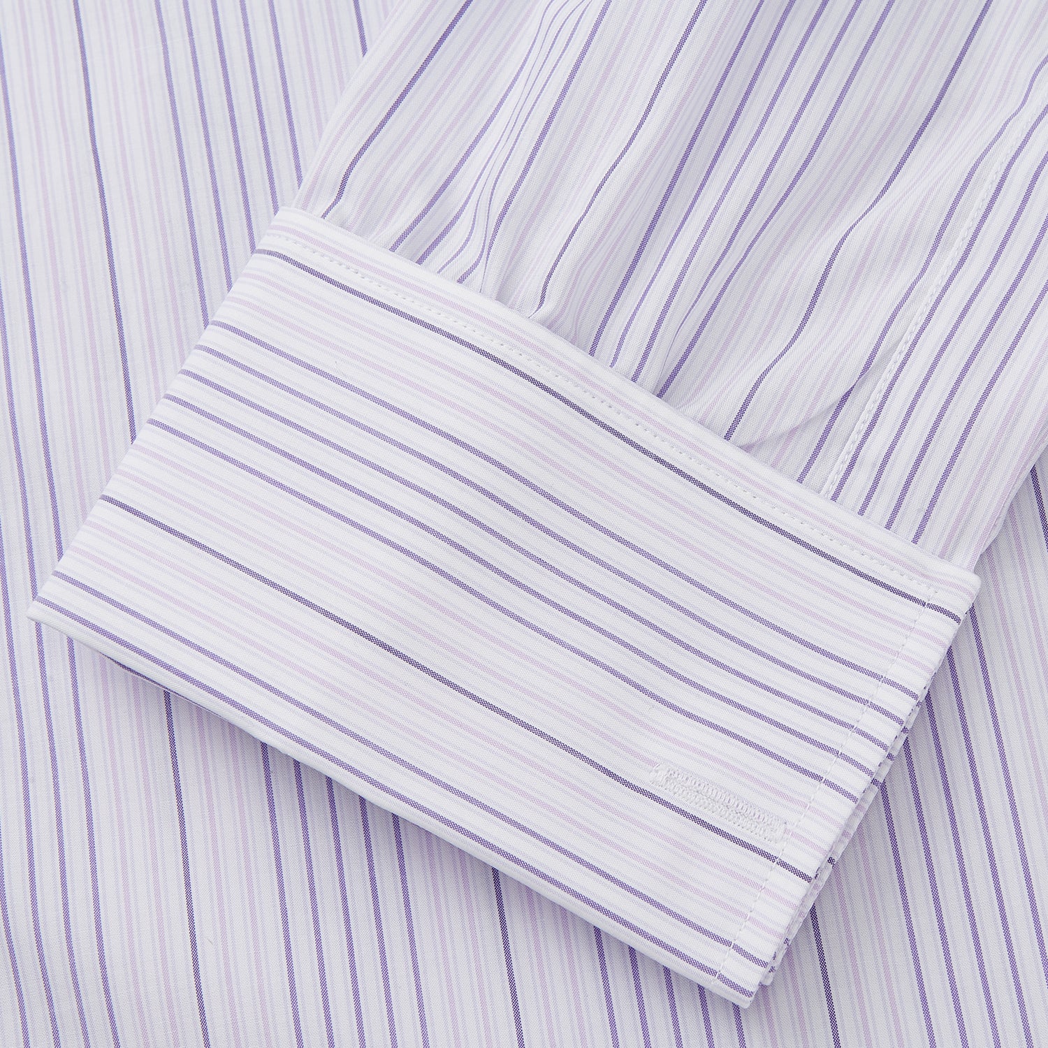 View 3 of product The Turnbull & Asser Purple and White Stripe Twill Cotton Regular Fit Shirt features a T&A collar, double cuffs, and thin vertical stripes, displayed against a white background.