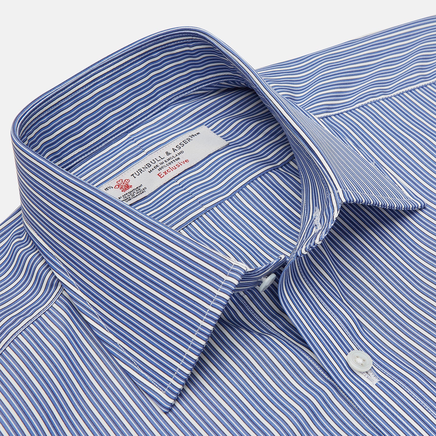View 3 of product The Turnbull & Asser Navy Rich Stripe Shirt features a T&A collar, 3-button cuffs, blue with white vertical stripes, and a button-down front—shown laid flat on a white background.