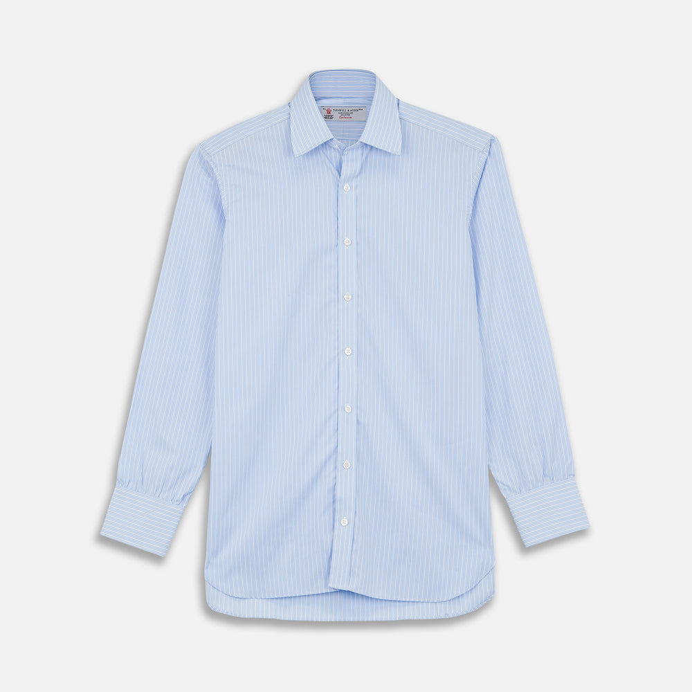 The Turnbull & Asser Light Blue Rich Stripe Shirt features a T&A collar, three-button cuffs, and fine white vertical stripes. Shown neatly laid flat on a white background.