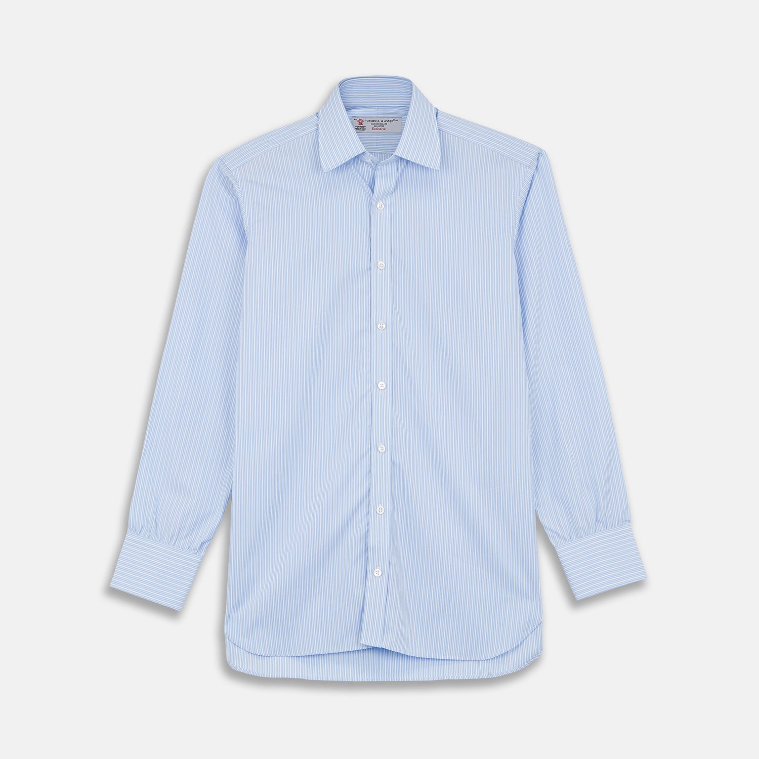 View 1 of product The Turnbull & Asser Light Blue Rich Stripe Shirt features a T&A collar, three-button cuffs, and fine white vertical stripes. Shown neatly laid flat on a white background.