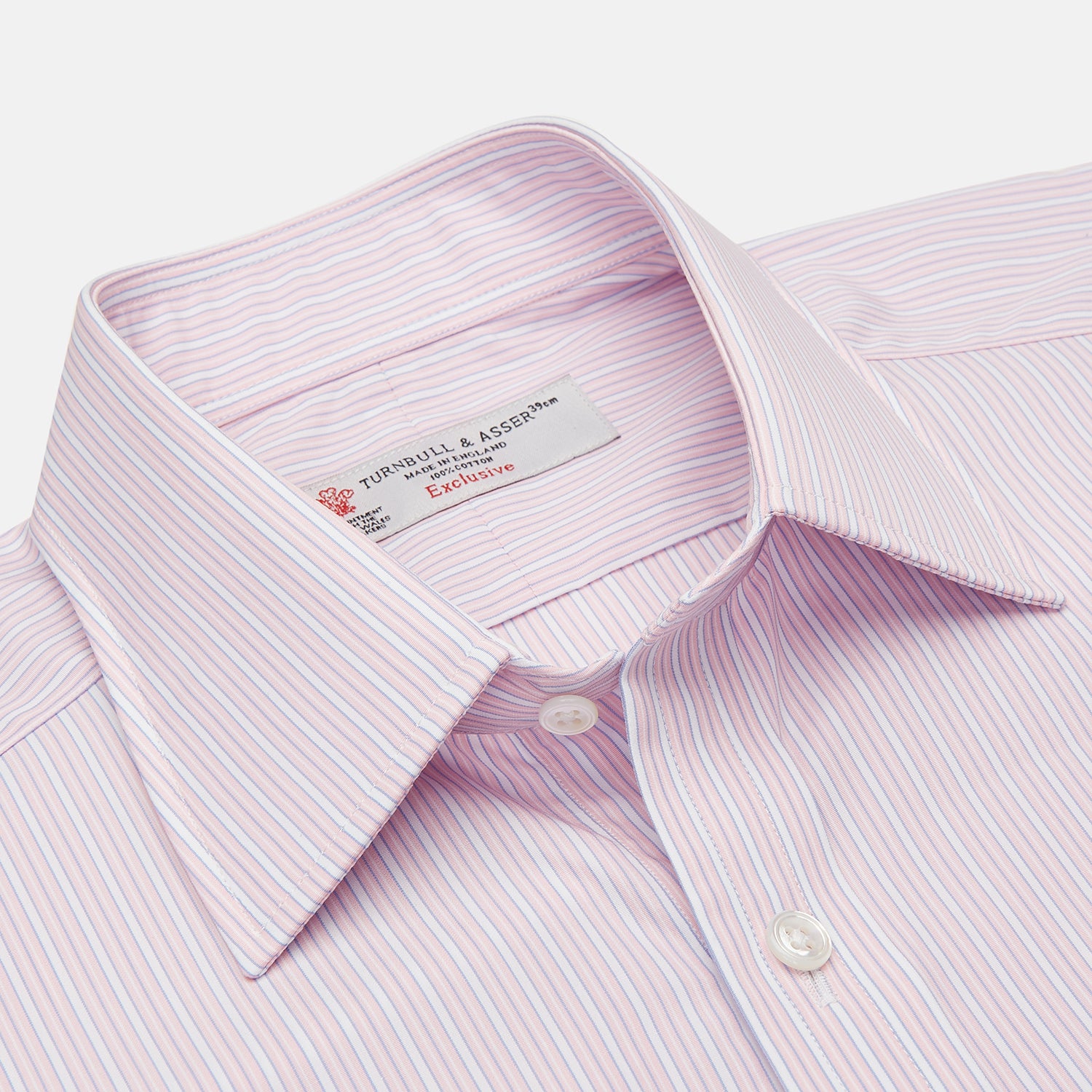 View 3 of product The Pink Rich Stripe Shirt by Turnbull & Asser features a T&A collar, 3-button cuffs, and soft Portland cloth with faint vertical stripes—luxuriously crafted and shown on a white background.