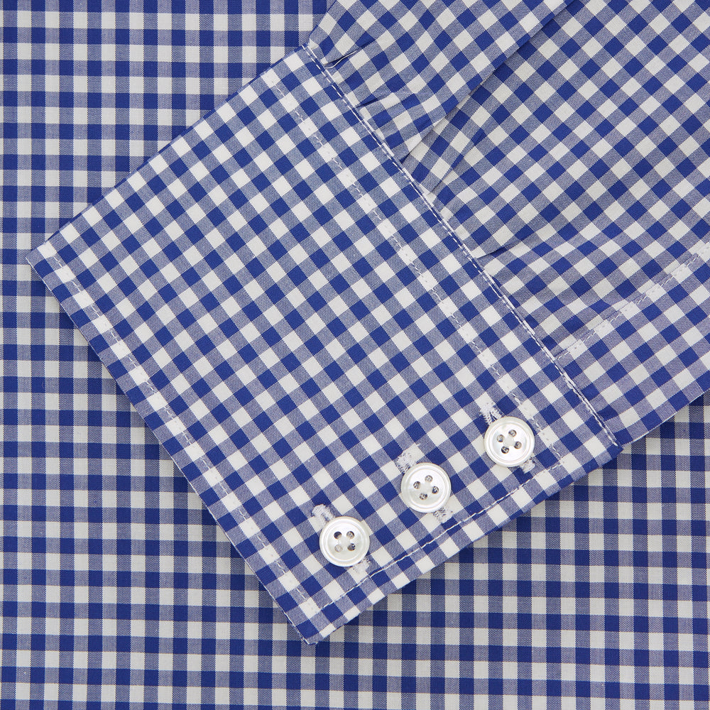 The Turnbull & Asser Navy & White Gingham Check Cotton Regular Fit Shirt features a T&A collar, 3-button cuffs, and is displayed neatly folded on a plain white background.