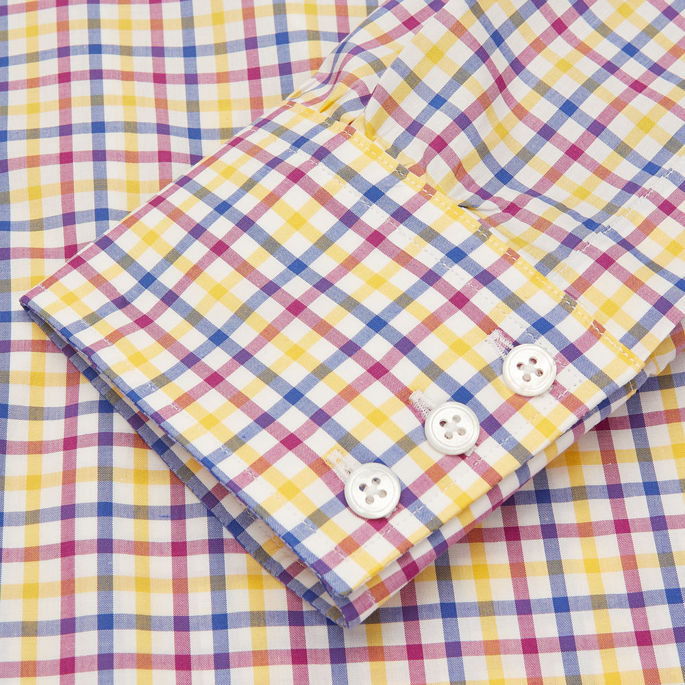 The Turnbull & Asser Blue, Yellow and Pink Check Shirt features a signature T&A collar, 3-button cuffs, and vibrant checks—an essential long-sleeve button-down for any men's wardrobe.