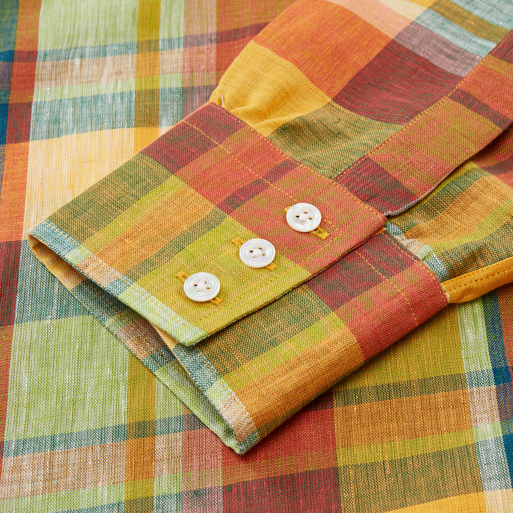 The Turnbull & Asser Orange Madras Check Regular Fit Linen Shirt features a T&A collar, 3-button cuffs, and a vibrant multicolor plaid pattern, shown on a white background.