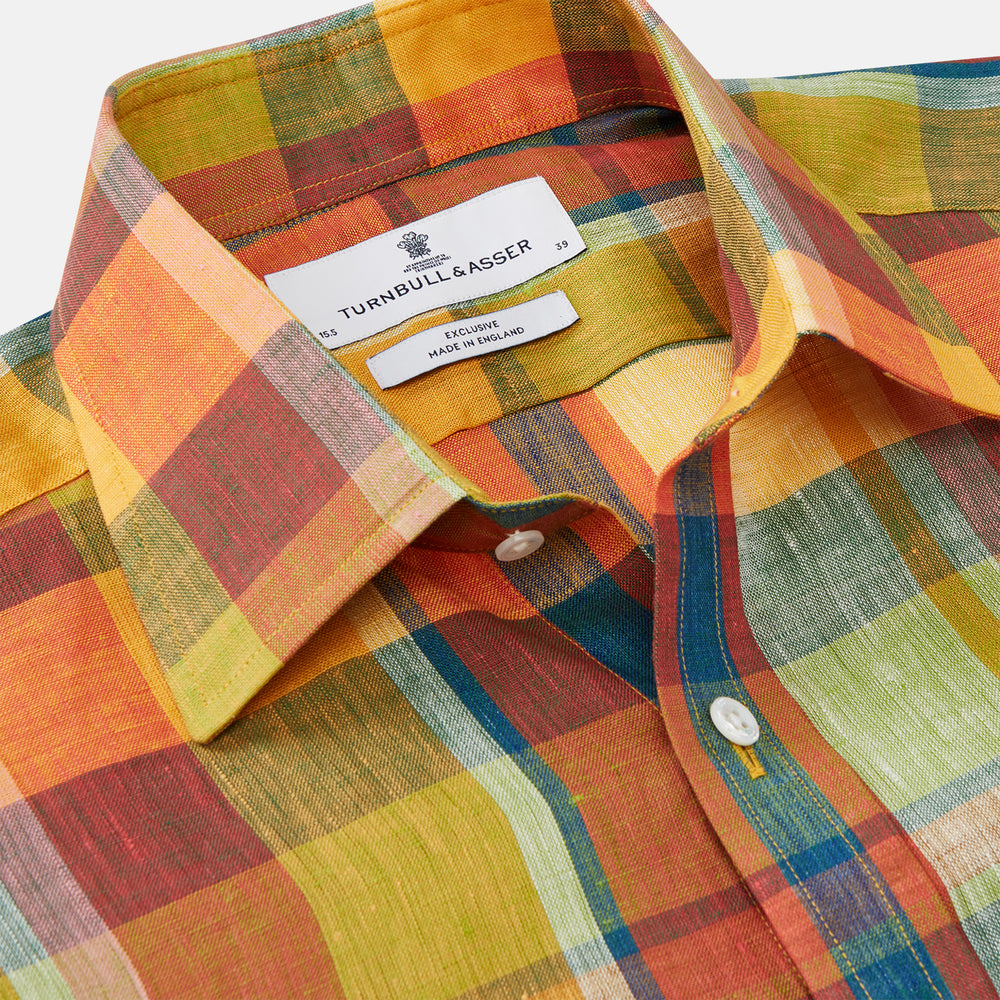 The Turnbull & Asser Orange Madras Check Regular Fit Linen Shirt features a T&A collar, 3-button cuffs, and a vibrant multicolor plaid pattern, shown on a white background.