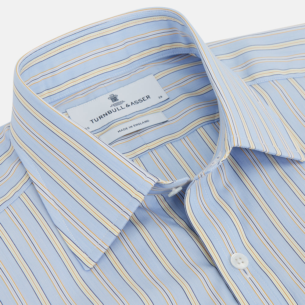 The Turnbull & Asser Blue and Yellow Stripe Poplin Cotton Regular Fit Shirt features a T&A collar, 3-button cuffs, and vertical stripes. It is laid flat on a white background.
