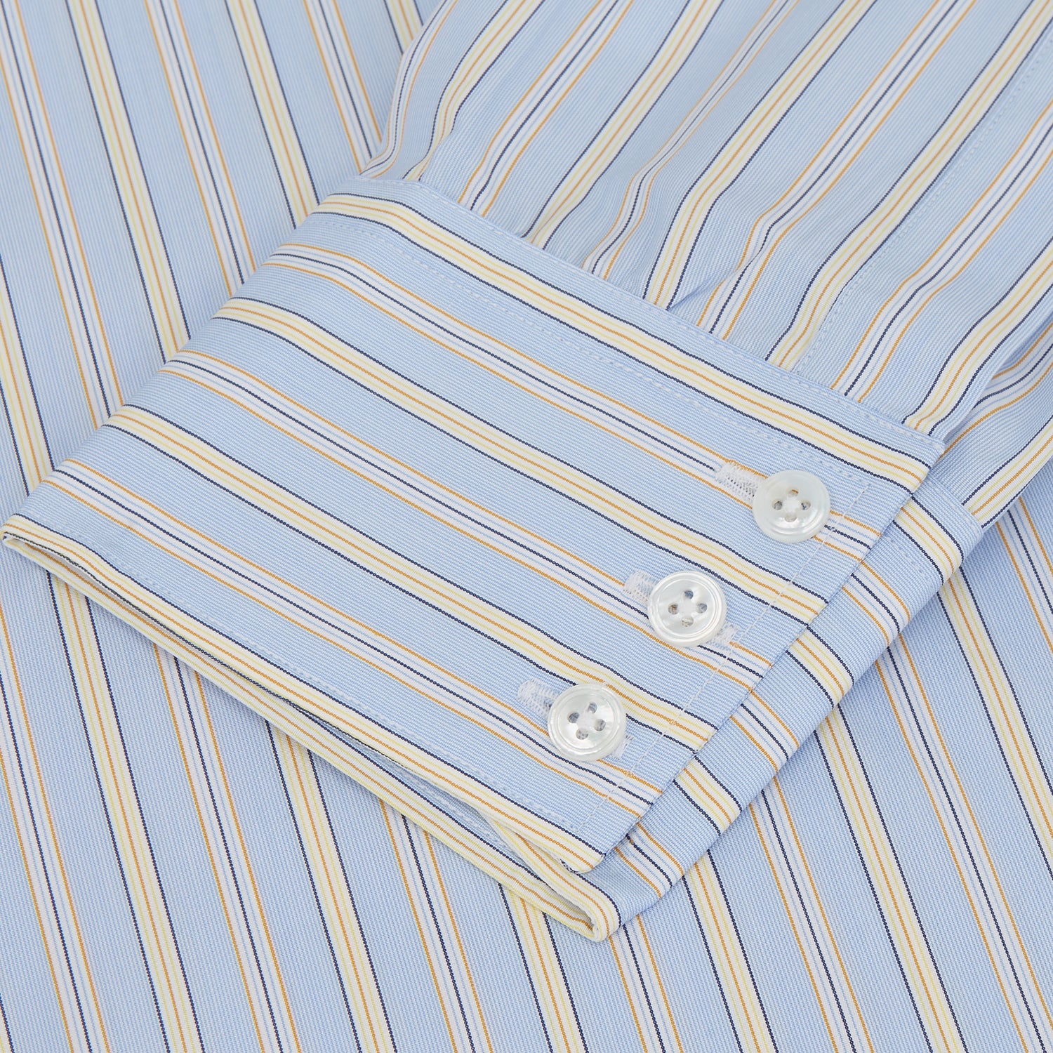 View 3 of product The Turnbull & Asser Blue and Yellow Stripe Poplin Cotton Regular Fit Shirt features a T&A collar, 3-button cuffs, and vertical stripes. It is laid flat on a white background.