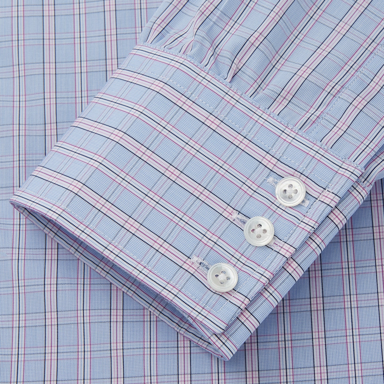 View 3 of product The Turnbull & Asser Blue and Pink Check Poplin Cotton Regular Fit Shirt features a T&A collar, 3-button cuffs, and a blue and pink check pattern, shown laid flat on a white background.