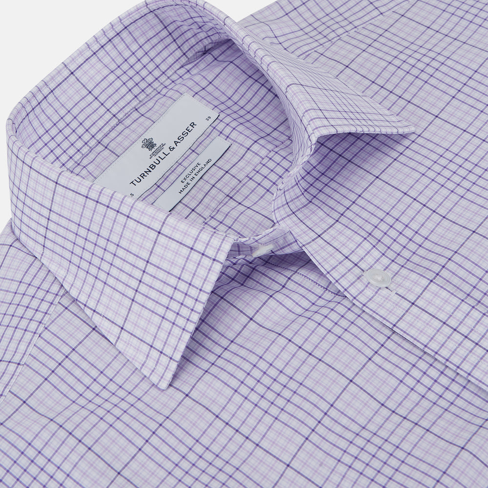 The Turnbull & Asser SHI002-HH3865 shirt features a fine purple check pattern, TA collar, 3 button cuffs, crafted from superfine Zephir cotton. Shown laid flat on a white background.