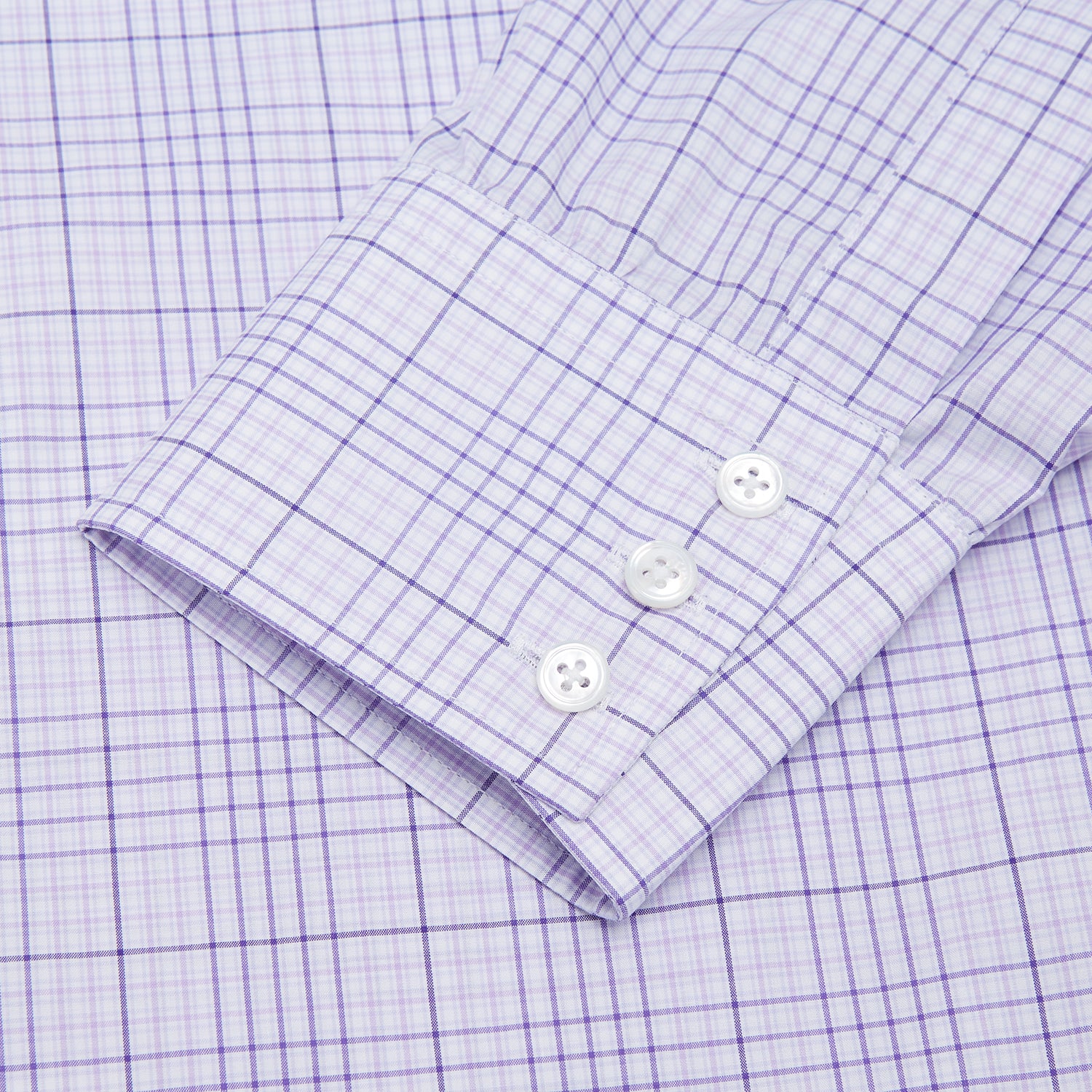 View 3 of product The Turnbull & Asser SHI002-HH3865 shirt features a fine purple check pattern, TA collar, 3 button cuffs, crafted from superfine Zephir cotton. Shown laid flat on a white background.