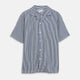 The Turnbull & Asser Navy & White Lyocell Stripe Holiday Fit Shirt is a short-sleeve button-up with a revere collar, vertical navy and white stripes, and a left chest pocket.