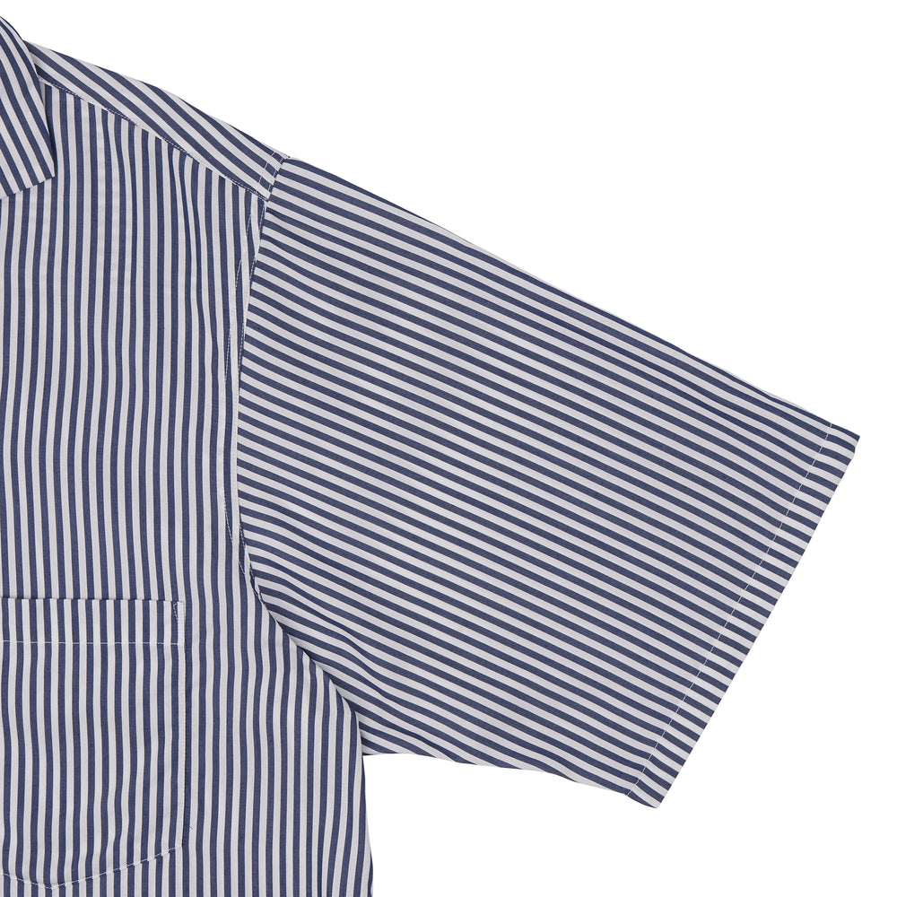 The Turnbull & Asser Navy & White Lyocell Stripe Holiday Fit Shirt is a short-sleeve button-up with a revere collar, vertical navy and white stripes, and a left chest pocket.