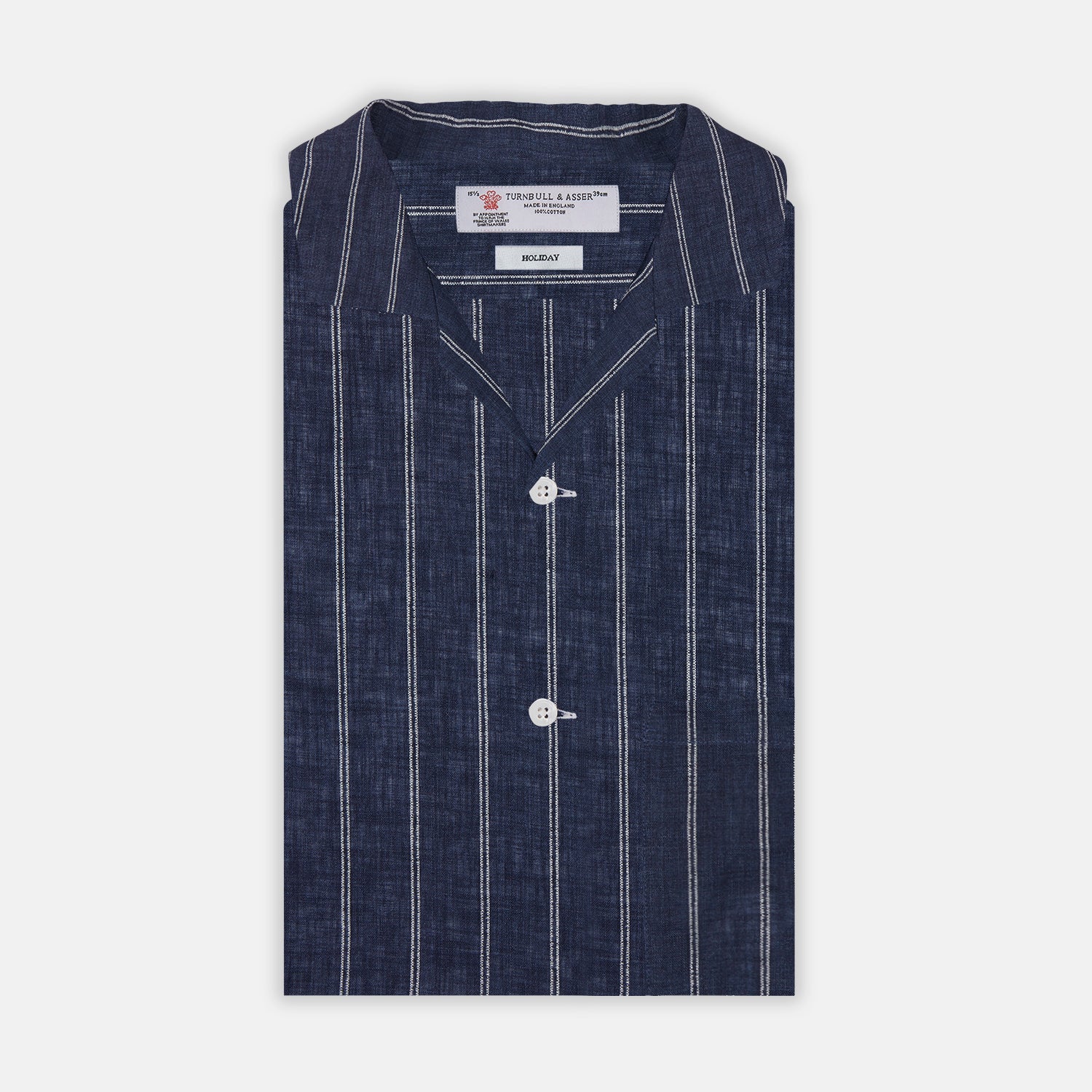 View 1 of product The Turnbull & Asser Holiday Fit Stripe Linen Short Sleeve Shirt features a navy background with vertical white stripes, a revere collar, and white buttons.