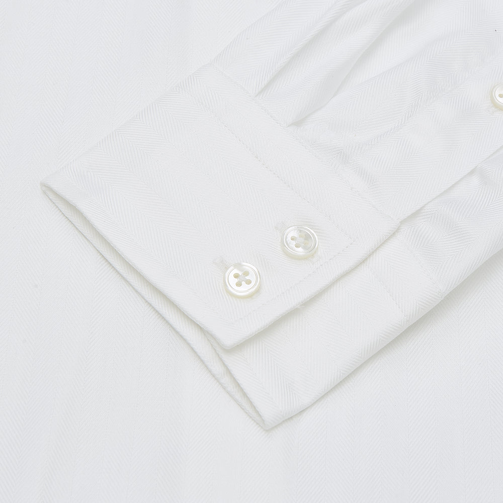 The Turnbull & Asser White Herringbone Tailored Fit Cotton Shirt features a long point collar, 2-button cuff, and button-down front, shown laid flat on a white background.