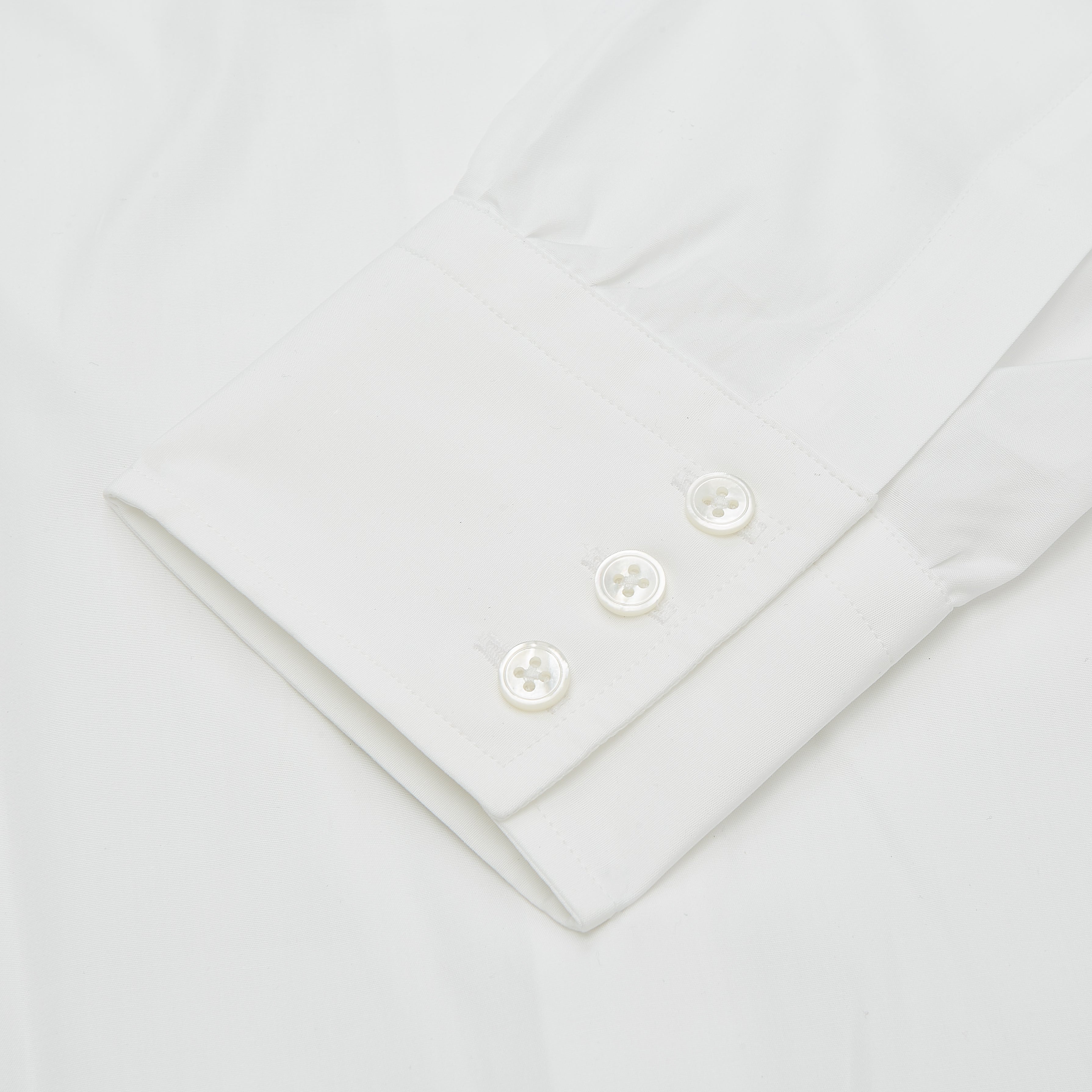 View 2 of product The Turnbull & Asser Plain White Regular Fit Cotton Shirt features a round collar and 3-button cuffs, showcased against a white background.