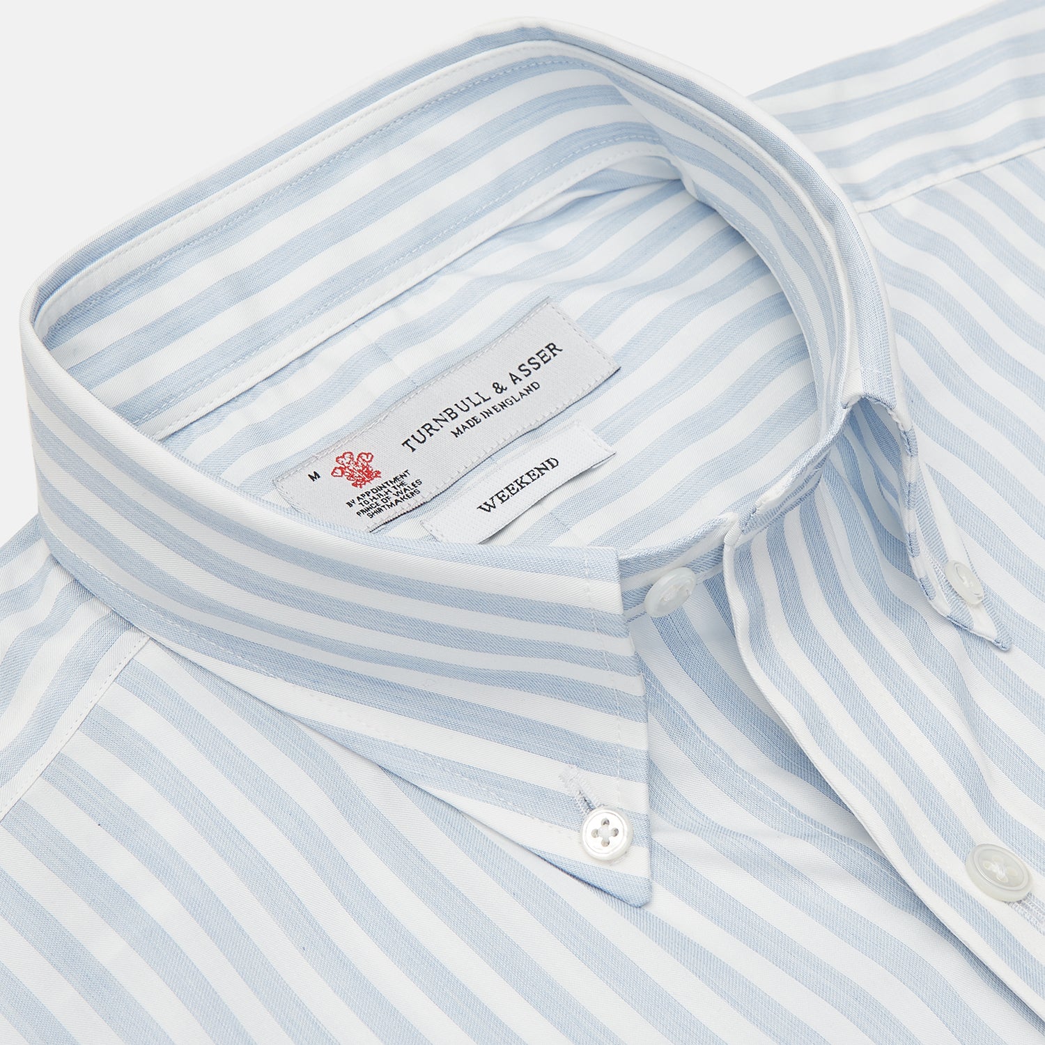 View 3 of product The Turnbull & Asser Weekend Fit Blue Stripe Cotton Shirt with Dorset collar and 1-button cuffs is laid flat on a white background, showcasing its classic long sleeves, striped design, and button-down front.