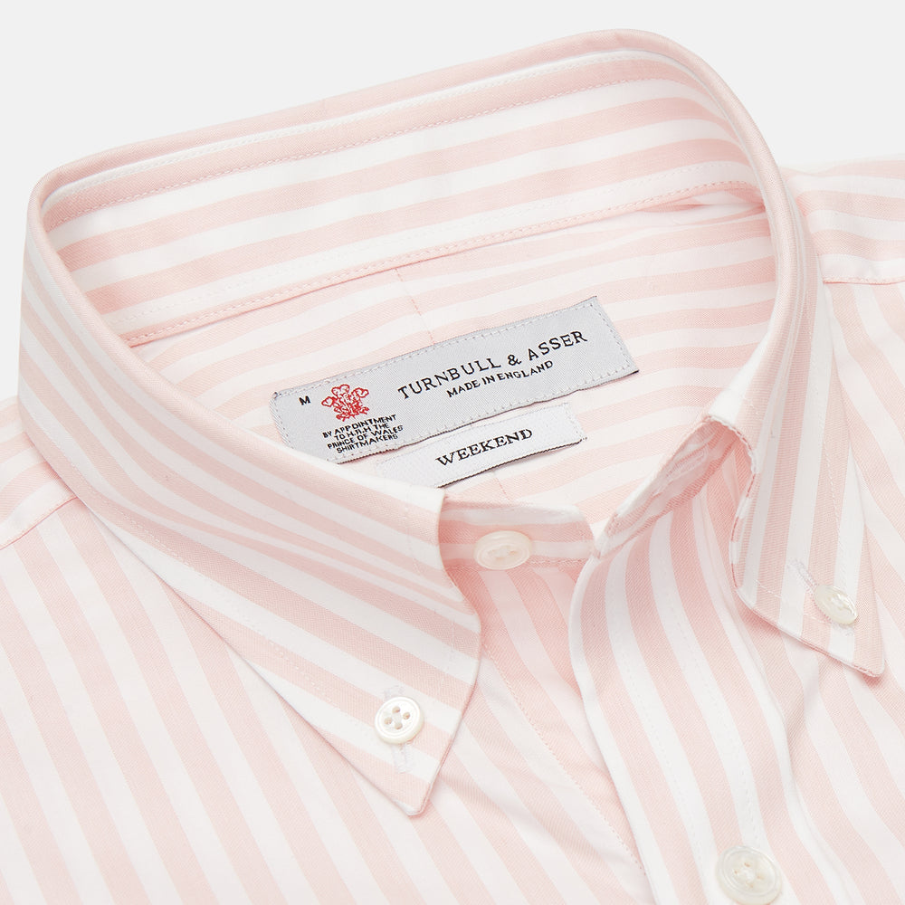 The Turnbull & Asser Weekend Fit Pink Stripe Cotton Shirt features a Dorset collar, 1-button cuffs, and light pink and white vertical stripes—perfect for the season.